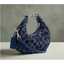 Load image into Gallery viewer, Blue handbag with silver hardware on a neutral background