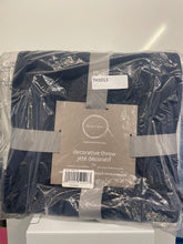 Load image into Gallery viewer, A packaged dark navy decorative throw blanket in clear plastic wrapping with a brown paper label that reads 'boudoir' and 'decorative throw jété decoratif'.