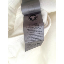 Load image into Gallery viewer, Textile label on a white fabric background