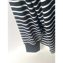 Load image into Gallery viewer, Close-up of a navy and white striped garment on a white background