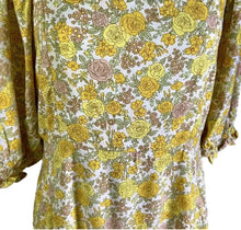 Load image into Gallery viewer, Floral dress with yellow and green pattern on a mannequin against a neutral background