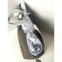 Load image into Gallery viewer, Gray handbag with a strap on a white background