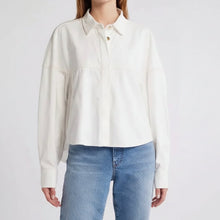 Load image into Gallery viewer, Person wearing a white blouse and blue jeans on a plain background