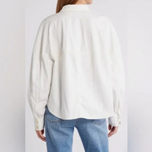 Load image into Gallery viewer, Person wearing a white long-sleeve shirt and blue jeans on a plain background