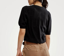 Load image into Gallery viewer, Person wearing a black sweater and beige pants on a white background