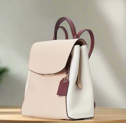 Beige and brown backpack on a white background