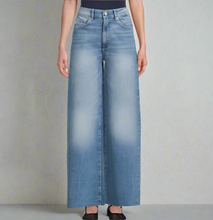 Load image into Gallery viewer, Wide-leg jeans worn by a person on a plain background