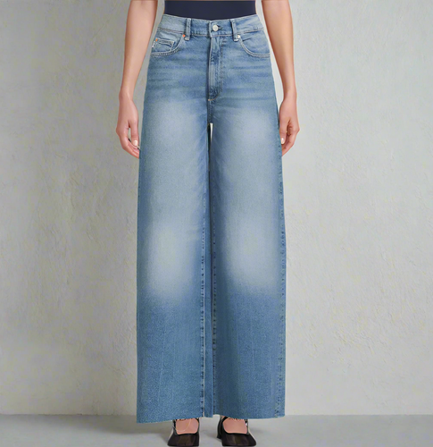 Wide-leg jeans worn by a person on a plain background
