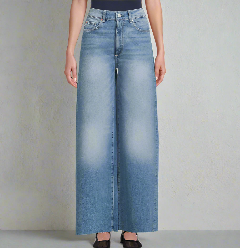 Wide-leg jeans worn by a person on a plain background