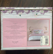 Load image into Gallery viewer, Packaged product with pink label and floral design on a wooden surface