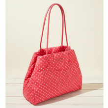 Load image into Gallery viewer, Red polka dot handbag with pink handles on a wooden surface