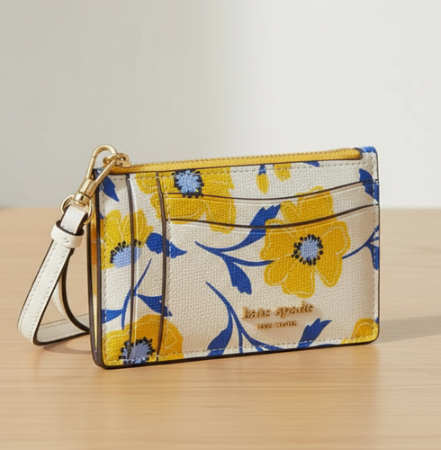 Floral patterned cardholder with a strap on a white background