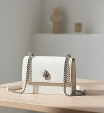 Load image into Gallery viewer, White handbag with silver chain strap on a white background
