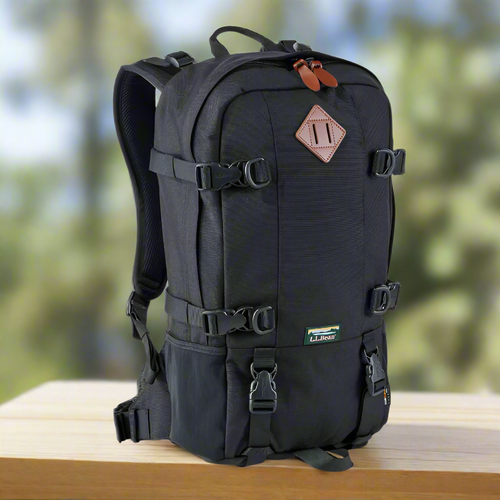 Black backpack with multiple straps and a visible brand logo on a white background