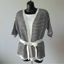 Load image into Gallery viewer, Mannequin wearing a black and white striped outfit with a belt on a plain background
