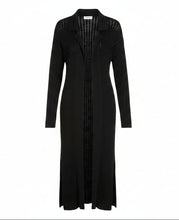 Load image into Gallery viewer, A black knit long-sleeve cardigan dress with a pointed collar and vertical eyelet cutouts, shown against a plain white background.