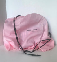 Load image into Gallery viewer, Pink drawstring bag with 'kate spade new york' branding on a white surface.
