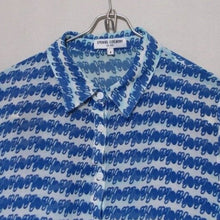 Load image into Gallery viewer, Blue patterned shirt on a hanger against a gray background