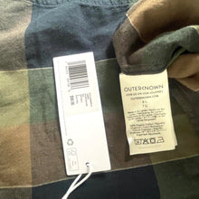 Load image into Gallery viewer, Camouflage jacket with a tag on a dark background