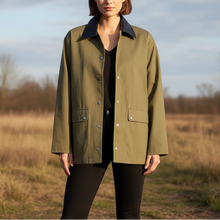 Load image into Gallery viewer, Person wearing a green jacket with a plain background