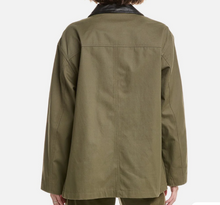 Load image into Gallery viewer, Green jacket worn by a person on a white background
