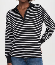 Load image into Gallery viewer, Black and white striped long-sleeve shirt worn by a person on a plain background