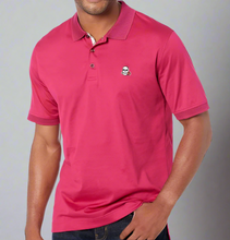 Load image into Gallery viewer, Person wearing a pink polo shirt with a small logo on a white background