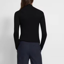 Load image into Gallery viewer, Person wearing a black long-sleeve top and dark pants on a light gray background